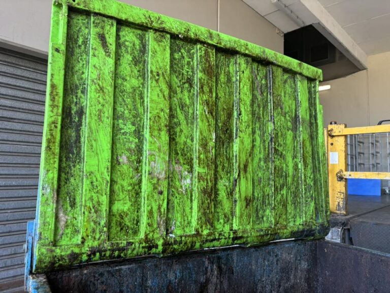 dirty skip bin with dirt on inside of lid